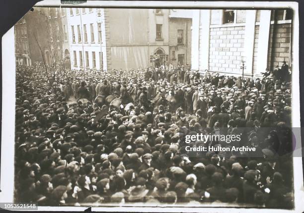 Crowd singing and cheering outside the courthouse after the Declaration of the Poll in the Londonderry by-election, Northern, Ireland, 31st January...