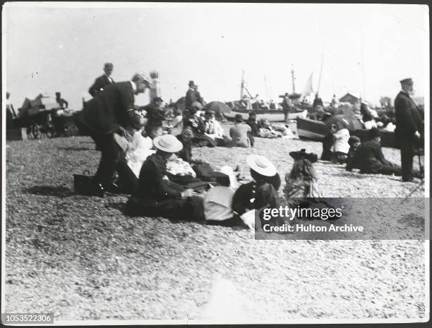 People on the beach at Southsea, England, 1890s.