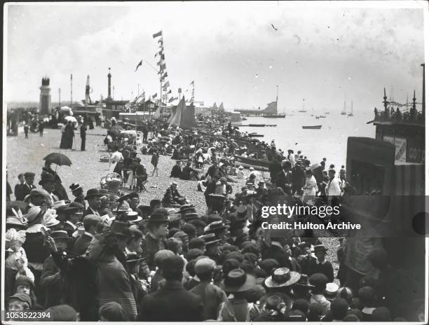 Punch and Judy show on the beach at Southsea, England, 1890s.