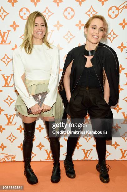 Sienna Miller and Noomi Rapace attend the Louis Vuitton X Grace Coddington Event on October 25, 2018 in New York City.