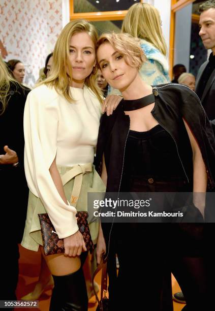 Sienna Miller and Noomi Rapace attend the Louis Vuitton X Grace Coddington Event on October 25, 2018 in New York City.