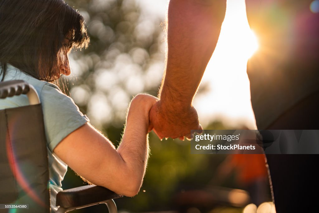Couple hands during sunset