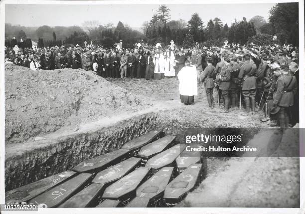 May 1915 Lusitania disaster, Some of the victims ' coffins in th mass grave at the old cemetery, Queenstown, Ireland, Queenstown, Ireland.