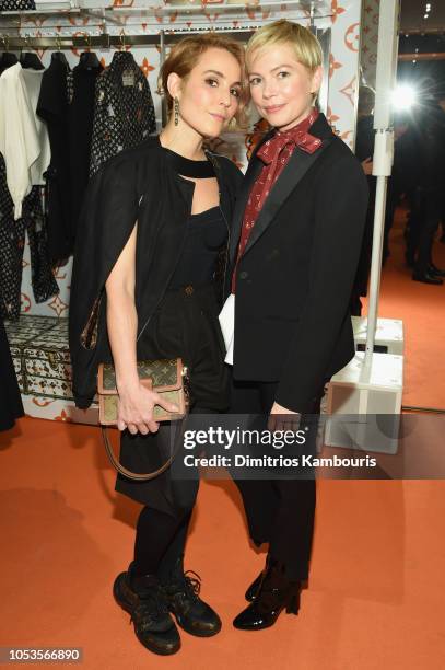 Noomi Rapace and Michelle Williams attend the Louis Vuitton X Grace Coddington Event on October 25, 2018 in New York City.