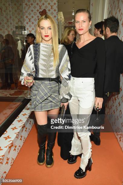 Riley Keough and Olympia Scarry attend the Louis Vuitton X Grace Coddington Event on October 25, 2018 in New York City.