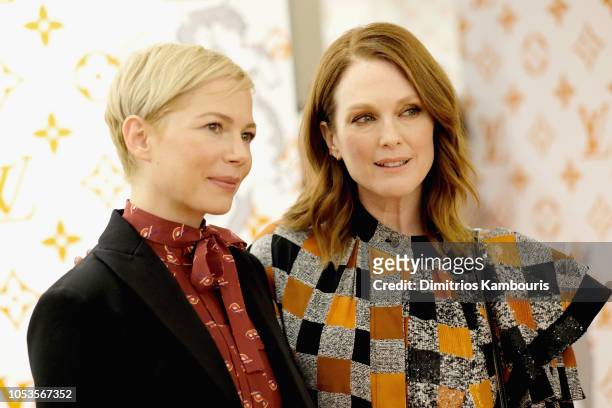 Julianne Moore and Michelle Williams attend the Louis Vuitton X Grace Coddington Event on October 25, 2018 in New York City.