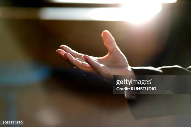 close up of businessman's hand extended palm up - human finger stock pictures, royalty-free photos & images