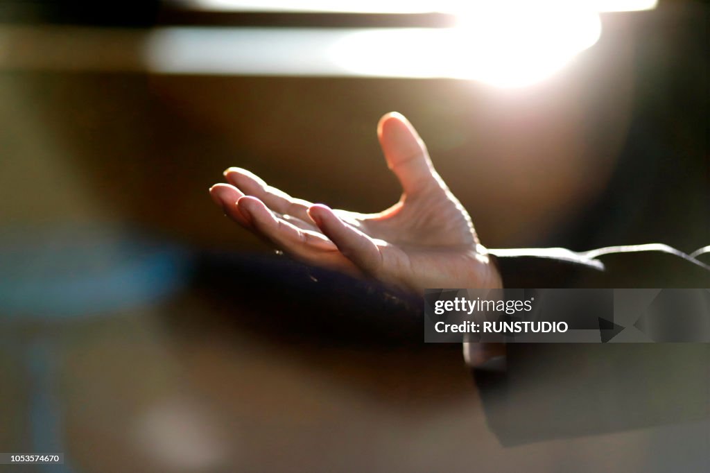 Close up of businessman's hand extended palm up