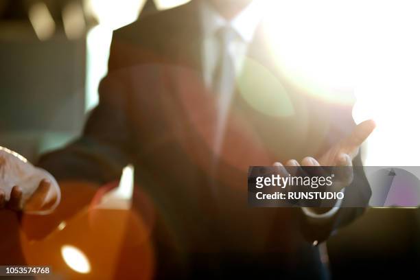 close up of businessman extending hands - non verbal communication stock-fotos und bilder
