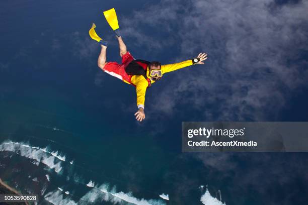 sky diver falls with flippers and a mask - funny hobbies stock pictures, royalty-free photos & images