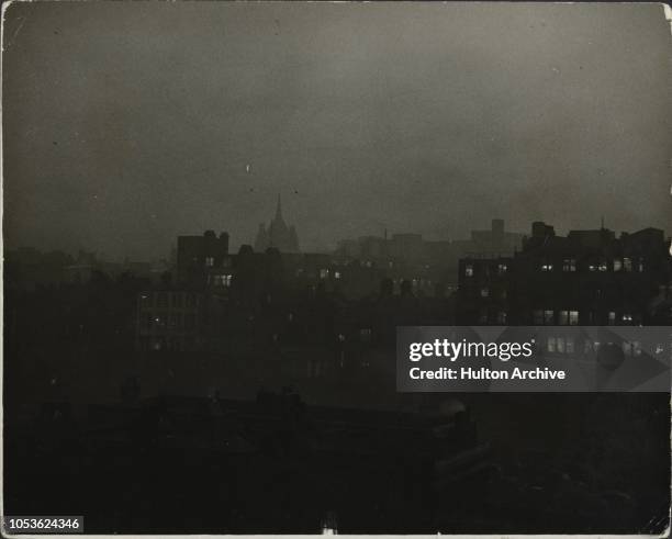 Blackout Over London, London was today blackened out by the dense fog, and this scene looking towards Hatton Garden, Holborn, from a roof in...