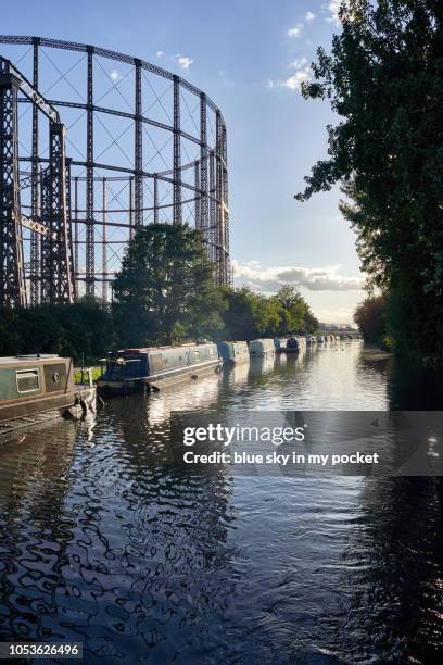 disused gas towers next to the paddington arm of the grand union canal, london, uk - grand union canal stock pictures, royalty-free photos & images