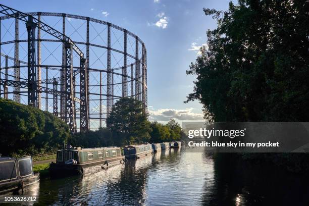 disused gas towers next to the paddington arm of the grand union canal, london, uk - grand union canal stock pictures, royalty-free photos & images