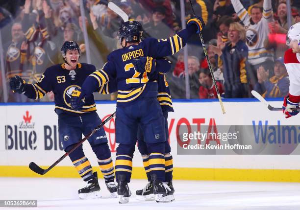 Kyle Okposo of the Buffalo Sabres celebrates with Jeff Skinner after scoring the winning goal late in the third period against the Montreal Canadiens...