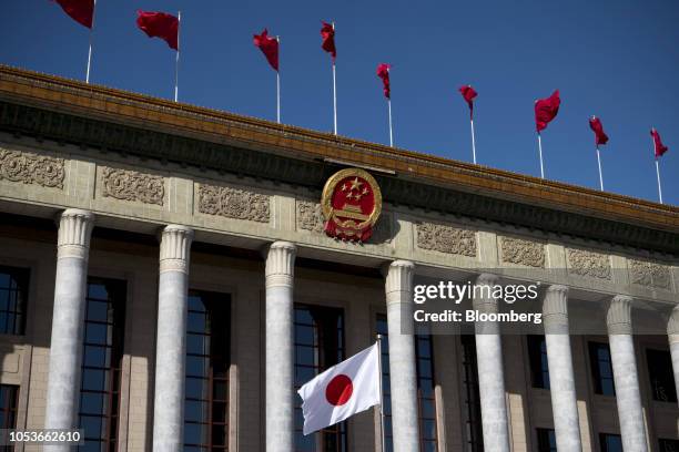 The Japanese flag is flown in front of the Great Hall of the People ahead of a welcome ceremony for Japanese Prime Minister Shinzo Abe, not pictured,...