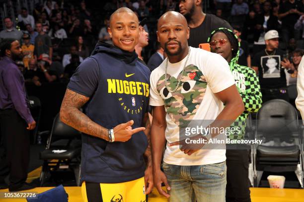 Boxer Floyd Mayweather Jr. And NBA player Isaiah Thomas attend a basketball game between the Los Angeles Lakers and the Denver Nuggets at Staples...