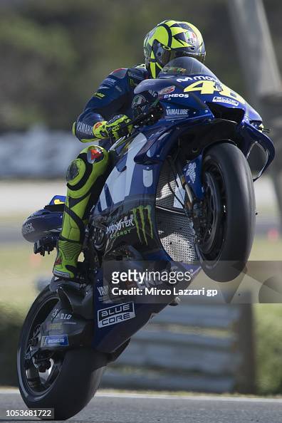 Valentino Rossi of Italy and Movistar Yamaha MotoGP lifts the front ...