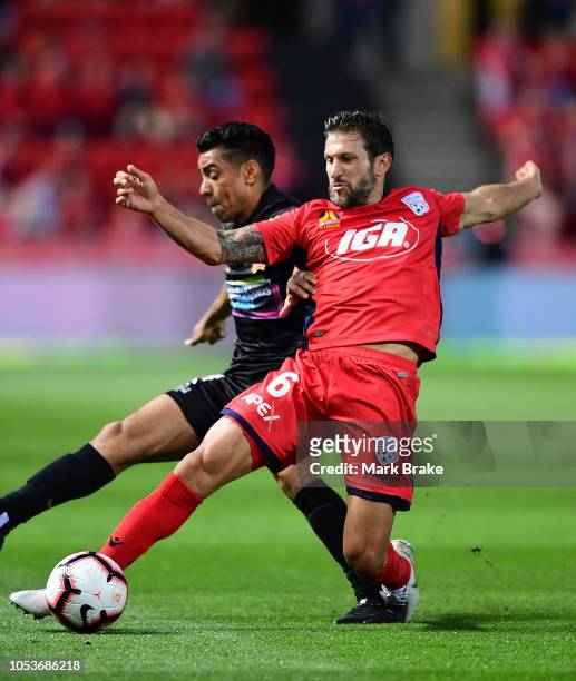 Vince Lia of Adelaide United competes with Jair of the Newcastle Jets during the round two A-League match between Adelaide United and the Newcastle...
