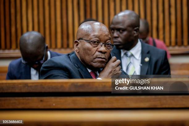 Former President of South Africa, Jacob Zuma speaks on the phone at the Randburg Magistrates Court on October 26 in Johannesburg, where his son...