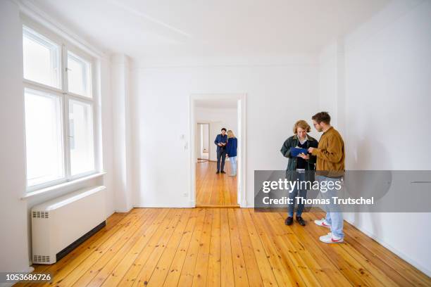 Posed scene on the topic of housing inspection. People are looking at a rental apartment on October 25, 2018 in Berlin, Germany.