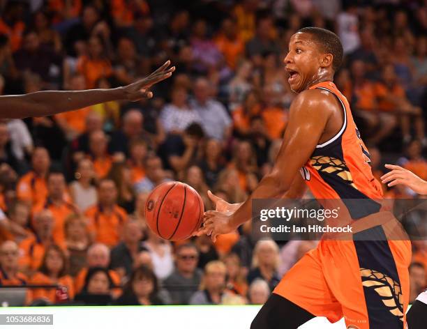 Devon Hall of the Taipans passes the ball during the round three NBL match between the Cairns Taipans and the Adelaide 36ers at Cairns Convention...