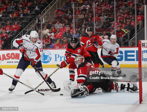 Keith Kinkaid of the New Jersey Devils makes the third period save on Jakub Vrana of the Washington Capitals at the Prudential Center on October 11,...