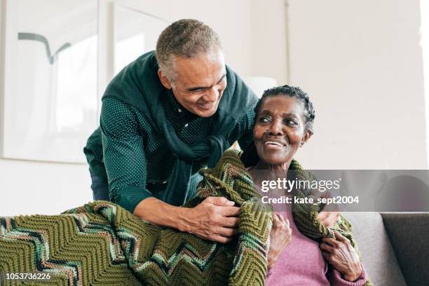 son visiting  mother in retirement home - dementia father stock pictures, royalty-free photos & images