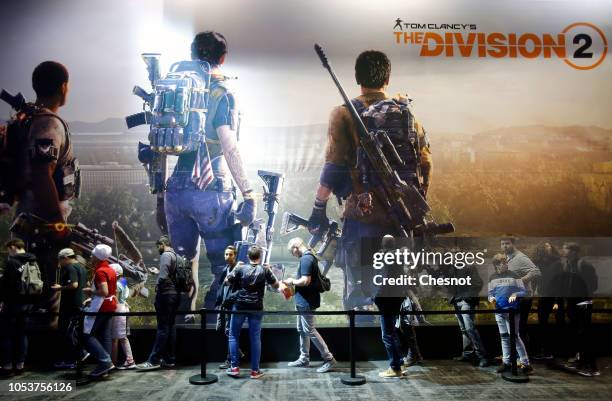 Visitors queue to play the video game 'Tom ClancyÕs The Division 2"developed by Massive Entertainment et published by Ubisoft during the 'Paris Games...