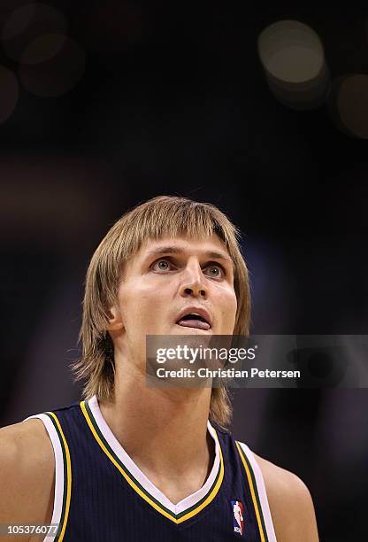 Andrei Kirilenko of the Utah Jazz shoots a free throw shot during the preseason NBA game against the Phoenix Suns at US Airways Center on October 12,...