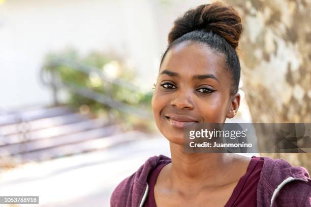 smiling beautiful young black woman - student headshot stock pictures, royalty-free photos & images