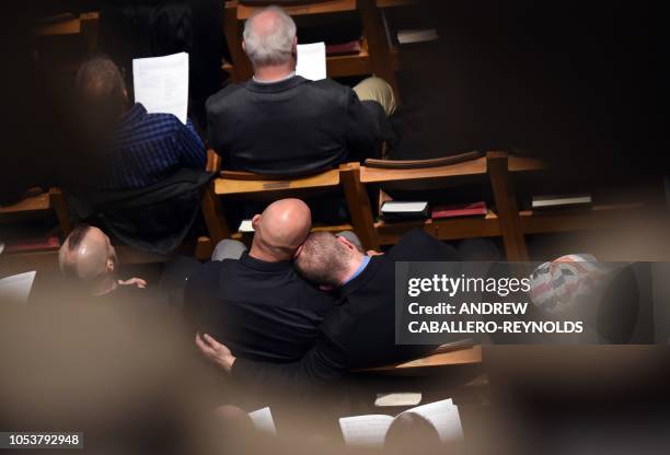 People attend the interment ceremony for Matthew Shepard at the Washington National Cathedral on October 26 in Washington, DC. - Two decades ago, the...