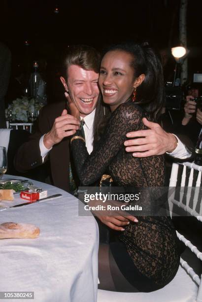 David Bowie and Iman during "7th On Sale" To Benefit AIDS Research - November 29, 1990 at 69th Regiment Armory in New York City, New York, United...