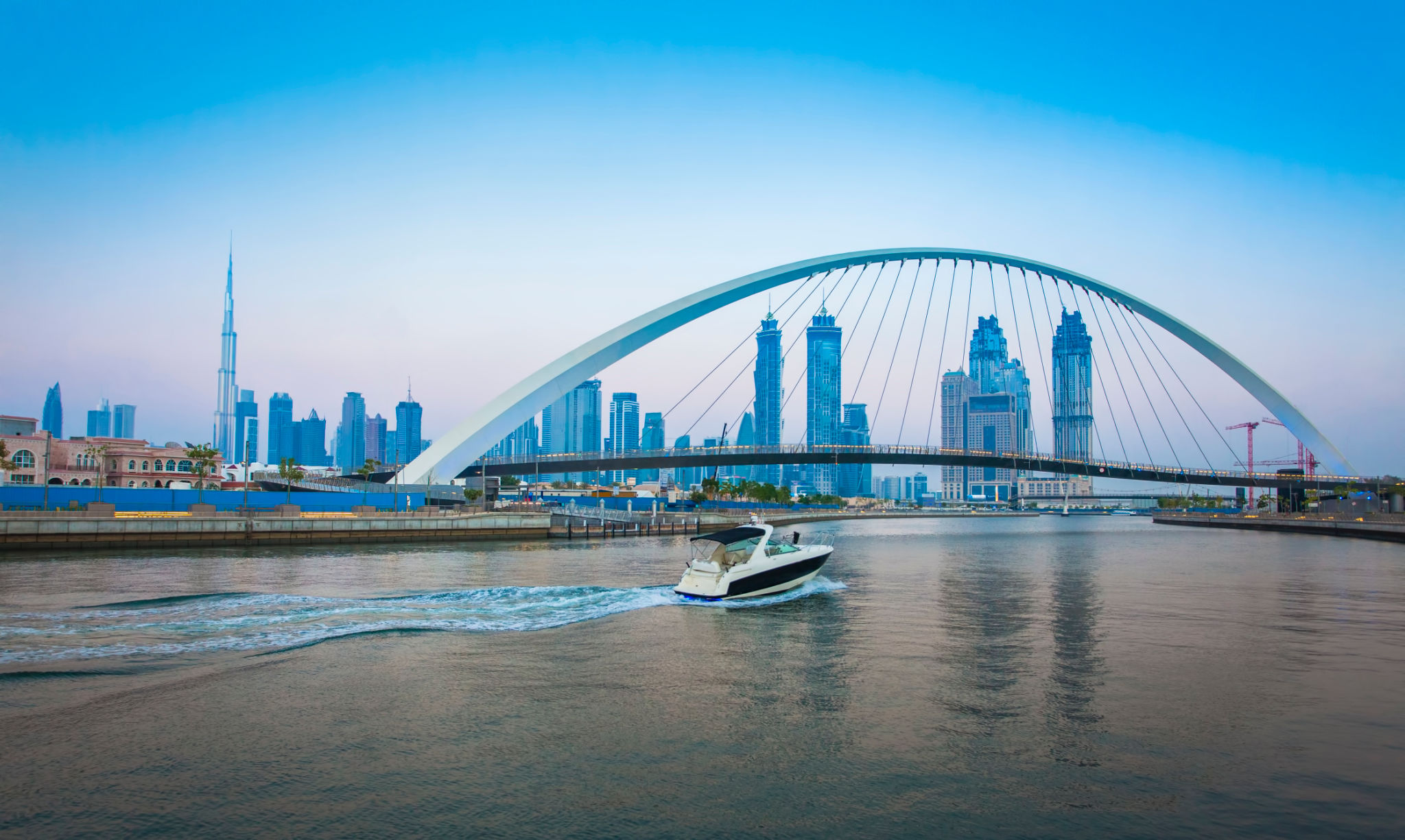 Tolerance bridge and boat in Dubai city Tolerance bridge and boat in Dubai city