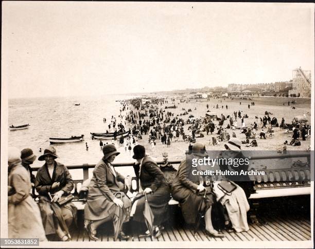 Holidaymakers on the beach at Skegness, England, circa 1930.