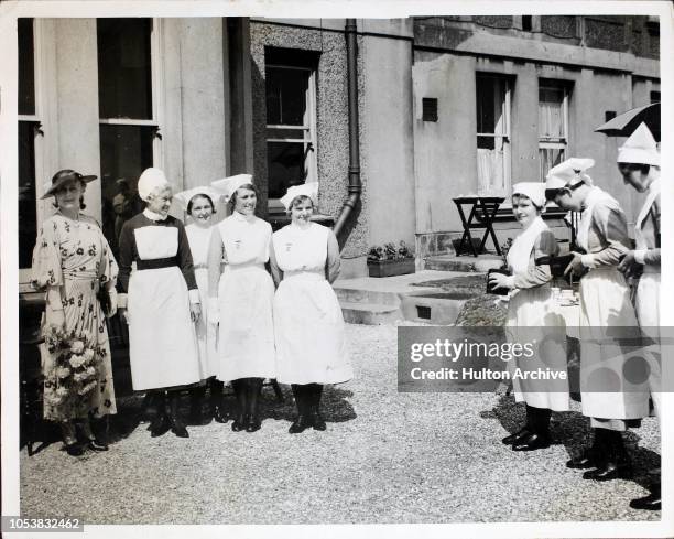 Princess Alice, Countess of Athlone posing with nurses at Sussex County Hospital in Brighton, where she is presenting prizes to the nurses, England,...