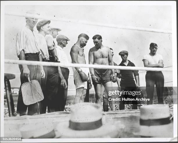 Jess Willard and Jack Dempsey in the ring before their heavyweight championship boxing match in Toledo, Ohio, USA, 4th July 1919.