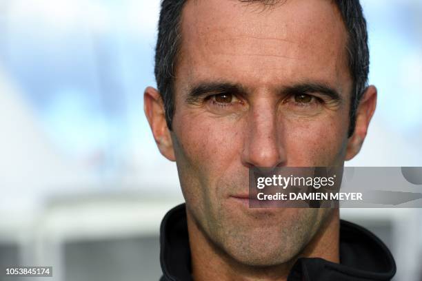 French skipper Armel Le Cleac'h poses on his Ultime class multihull 'Banque Populaire IX' in Saint-Malo, western France, on October 26 few days prior...