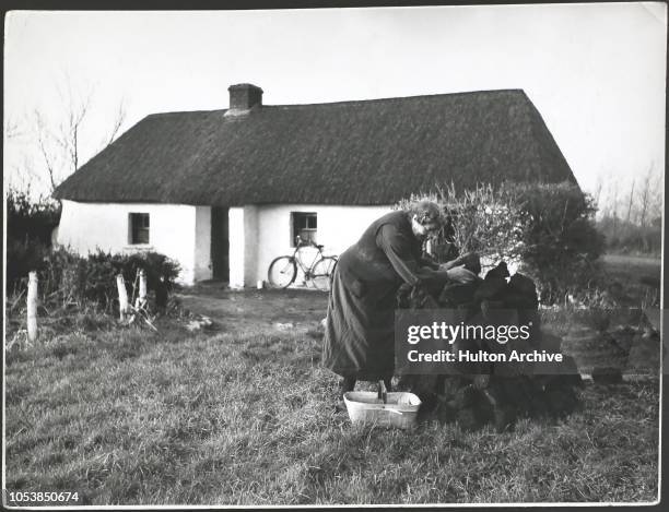 Peat outside cottage in Ireland, W. Ireland, Ireland.