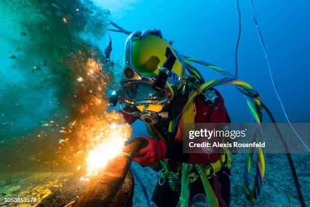 At a depth of 20 metres, a student diver is performing cutting exercises on April 24, 2018 in Saint-Mandrier-Sur-Mer, France. In the south of France,...