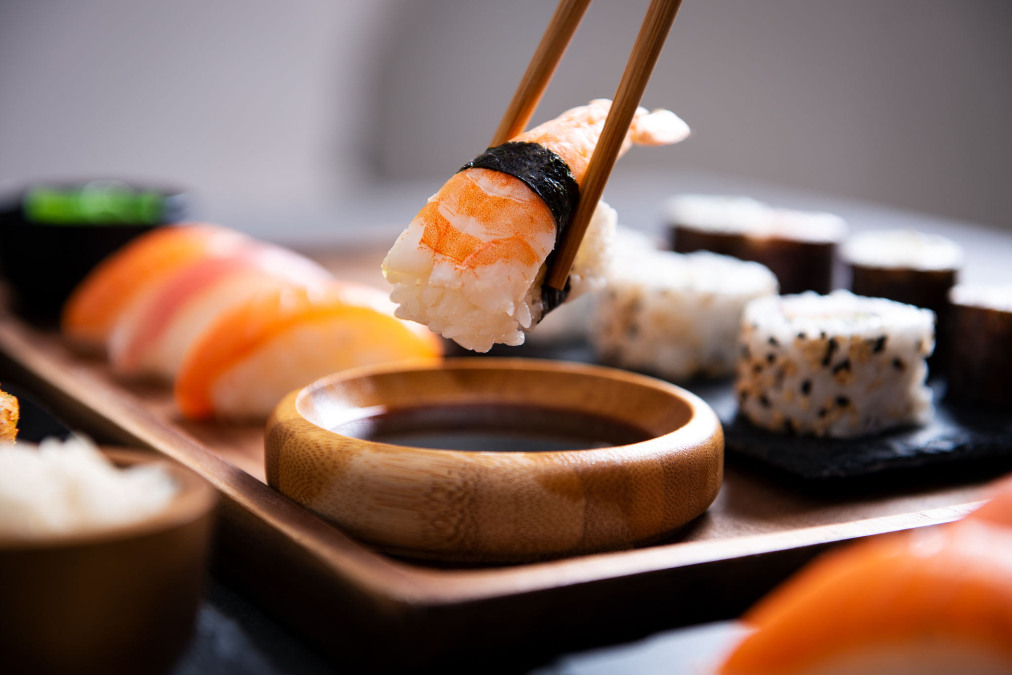 Chopstick with nigiri sushi piece Chopstick with nigiri sushi piece