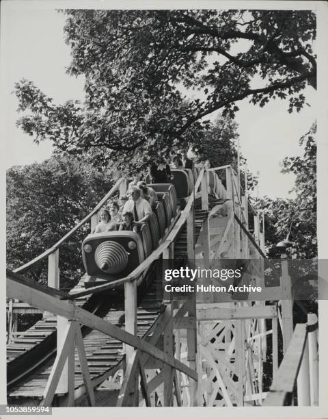 Car begins its descent on the 'Big Dipper' scenic railway at the Battersea Festival Gardens in London, a popular spot for holidaymakers, Battersea,...