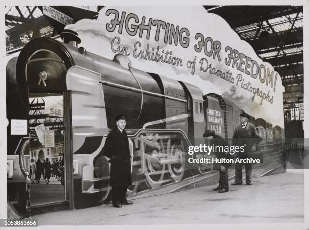 Fighting for Freedom Exhibition, The Four Main Line Railway Companies of Britain have opened a dramatic axhibition of 'pictographs' entitled 'Fightin...