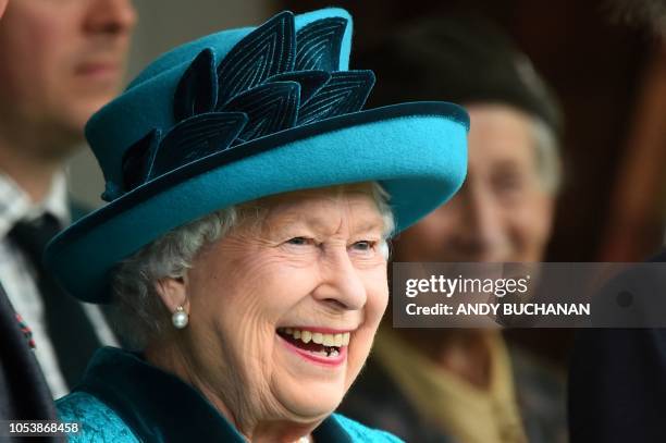 Britain's Prince Charles, Prince of Wales, Britain's Queen Elizabeth II and Britain's Princess Anne Princess Royal, look on during the annual Braemar...