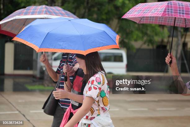 grandparents and grandchildren exploring city in the rain. - hot vietnamese women stock pictures, royalty-free photos & images