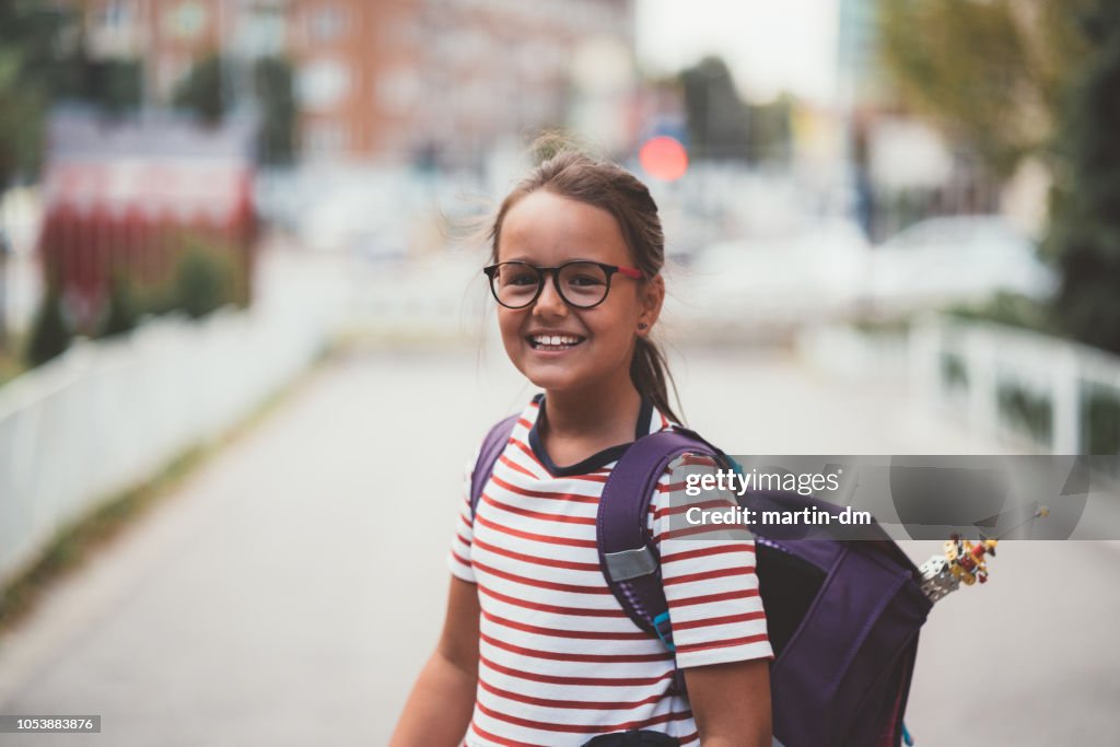 Back to school concept with happy schoolgirl