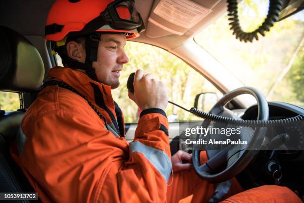firefighter driving in a fire truck all-terrain vehicle - emergency call - panic button stock pictures, royalty-free photos & images