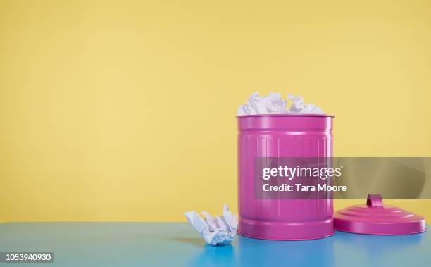 pink rubbish bin full of crumbled paper - bin stock pictures, royalty-free photos & images