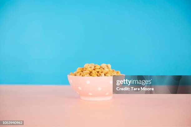 bowl of cereal with blue and pink background - bowl of cereal ストックフォトと画像