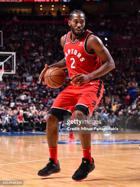 Kawhi Leonard of the Toronto Raptors dribbles the ball against the Brooklyn Nets during the preseason NBA game at the Bell Centre on October 10, 2018...