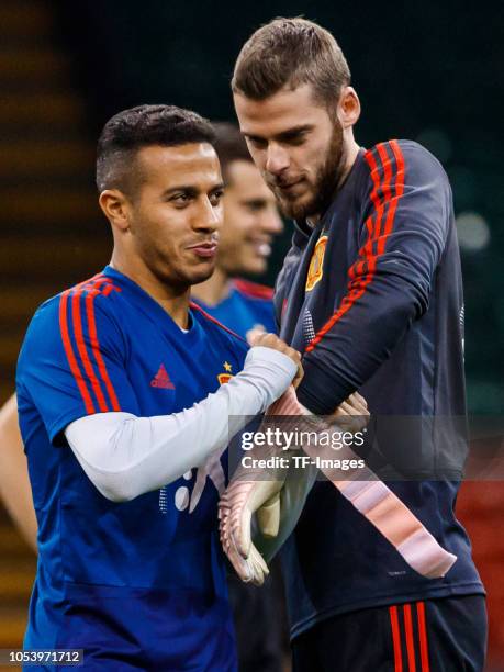 Goalkeeper David De Gea of Spain and Thiago Alcantara of Spain gesture during a training session on October 10, 2018 in Cardiff, Wales.